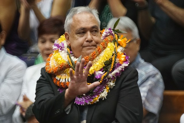 Mike McCartney waves after being confirmed to head DBEDT by a 15 to 10 vote in the Senate.