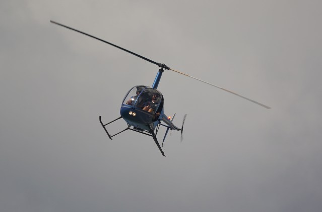 Robinson Helicopter leaves HNL airport. Daniel Inouye International Airport.