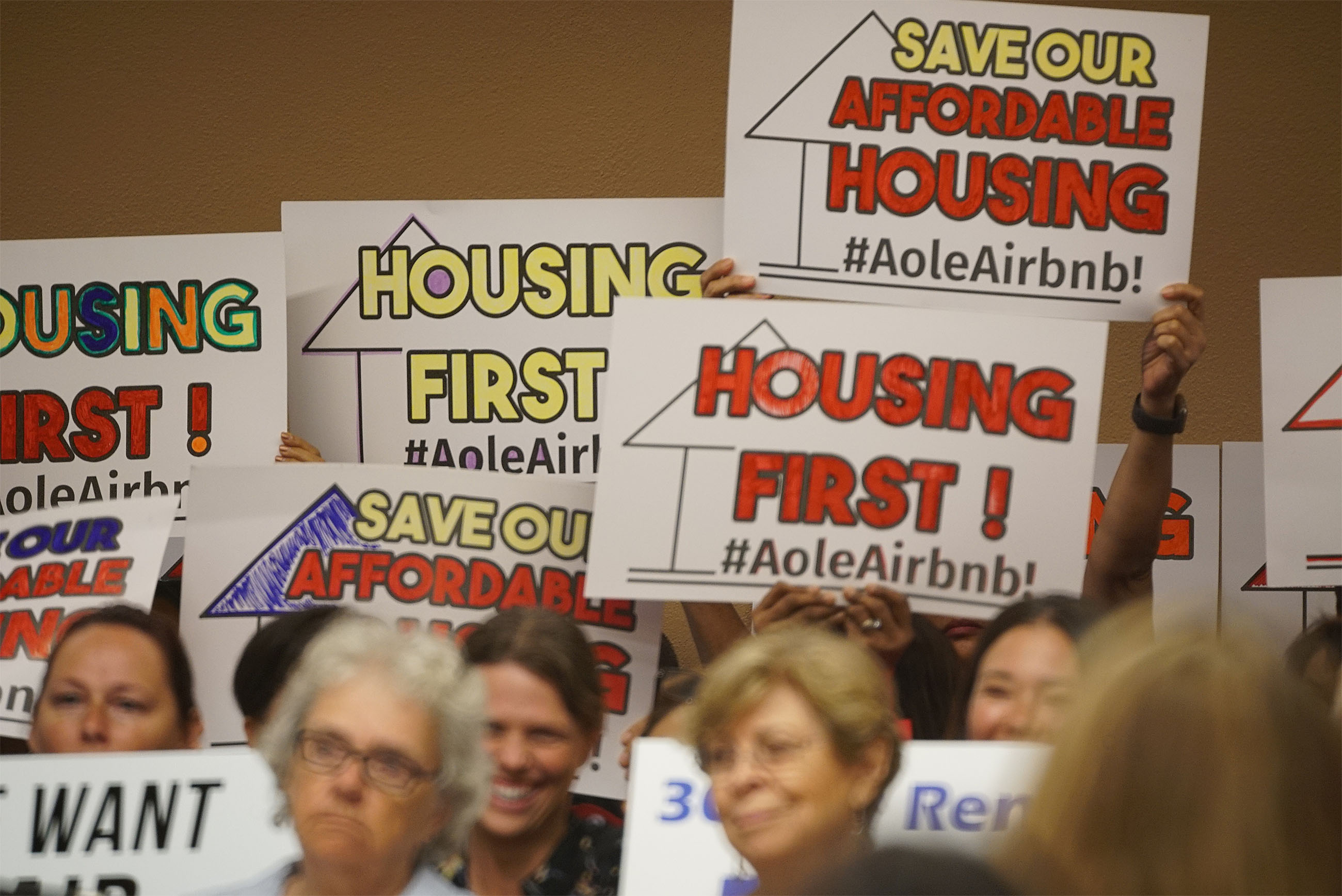 Sign holders in support of Bill 85 & 89 at the Honolulu City Council.