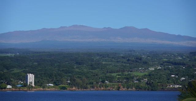 View thru Coconut Island with Mauna Kea Observatories.