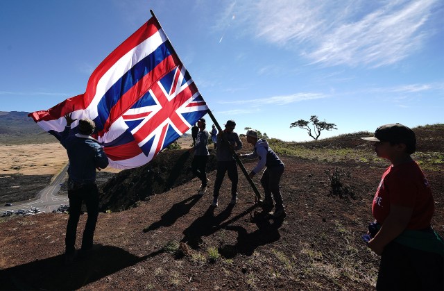Moving Hawaiian Flag atop the Kipuka Pu'u Huluhulu, Native Tree Sanctuary and Trail above the Maunakea Access road.