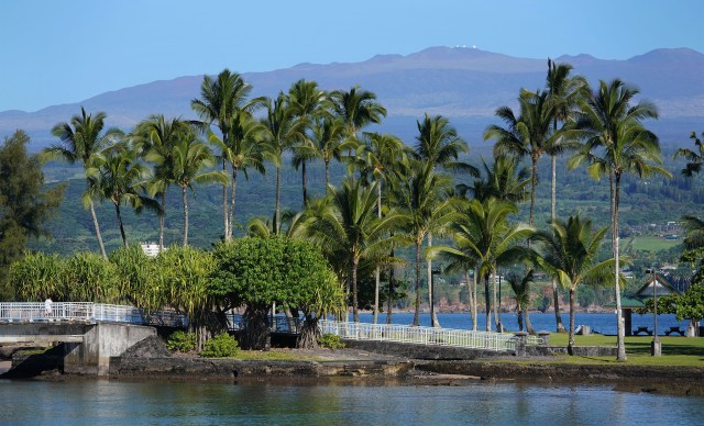 View thru Coconut Island with Mauna Kea Observatories.
