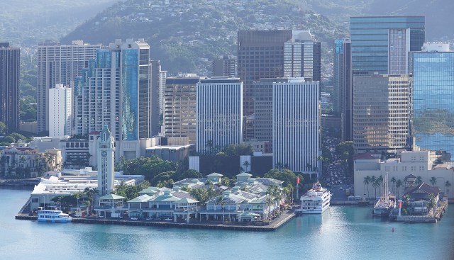 Downtown Honolulu buildings along Honolulu Harbor with Aloha Tower.