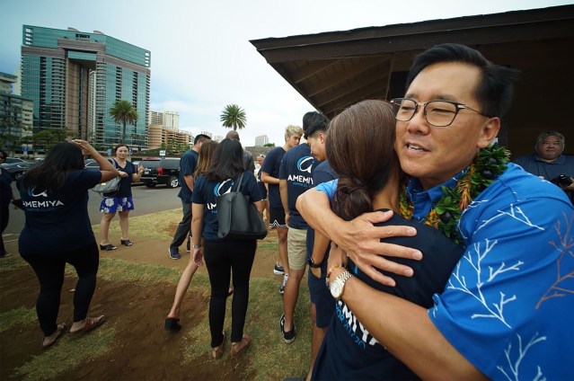 Keith Amemiya hugs supporters after announcing his candidacy for Mayor at Ala Wai Field.