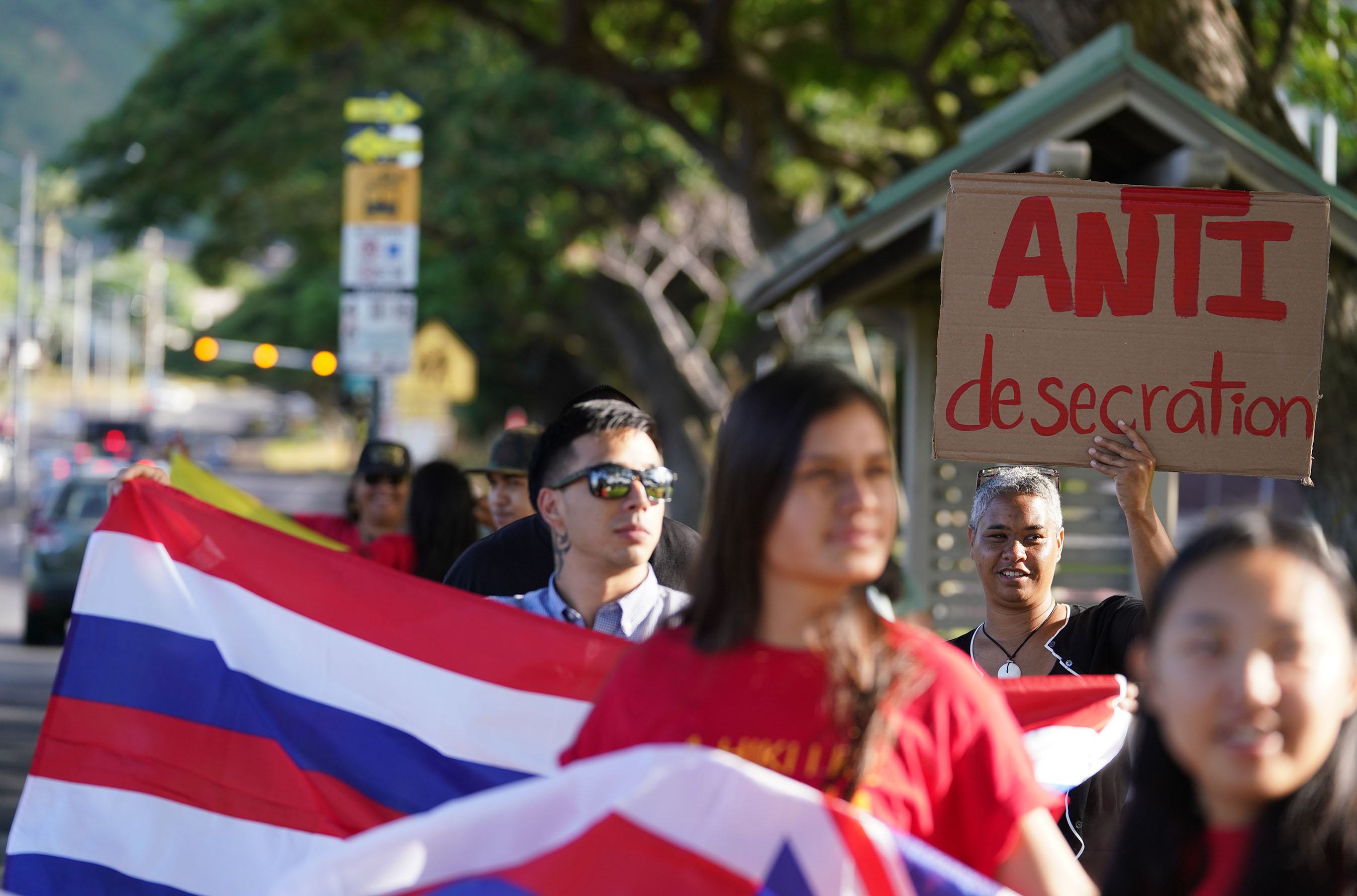 Demonstrators against the building of TMT line up for a rallly at University of Hawaii at Manoa on Dole street and University Avenue on the first day of classes.