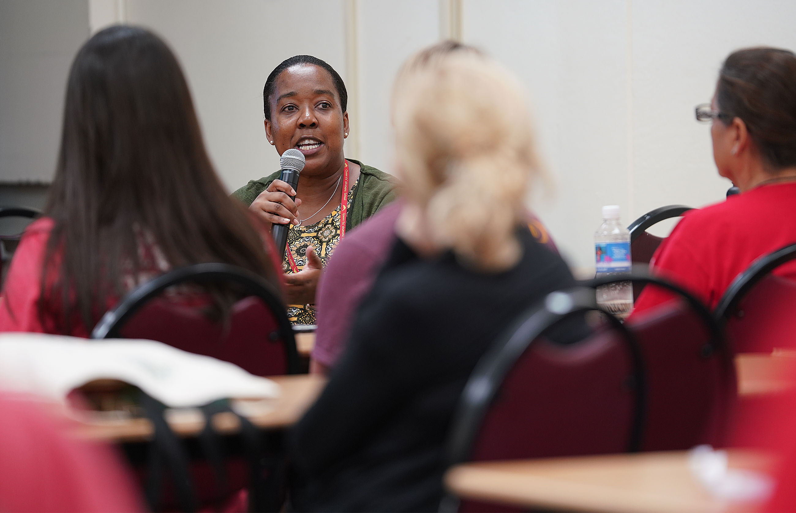 Queen Kaahumanu teacher Mary Bonnetty asks a question during salary session held at McKinley Adult School.