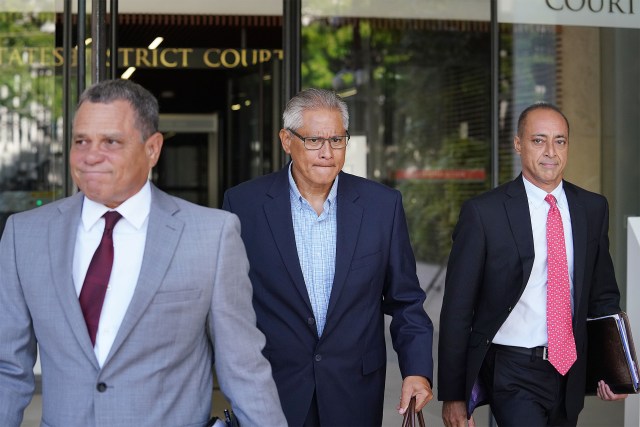 Louis Kealoha is flanked by Attorney Gary Modafferi and Attorney Gary Singh leaving US District Court.