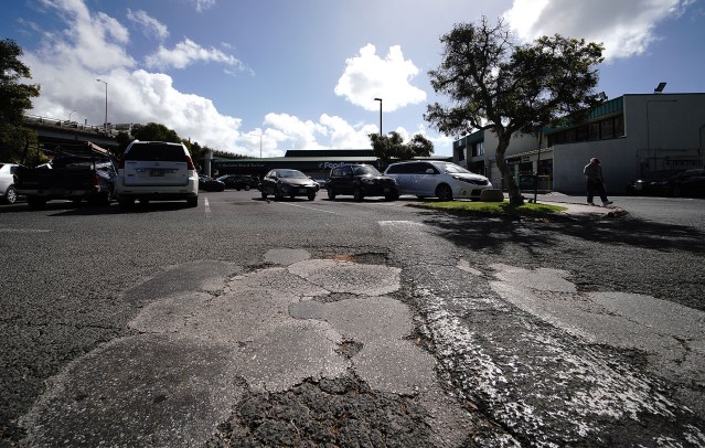 Market City Shopping Center badly patched parking area fronting Kaimuki Foodland.