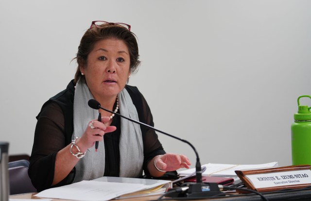 State Campaign Spending Commission Kristin Izumi Nitao speaks to John Carroll.