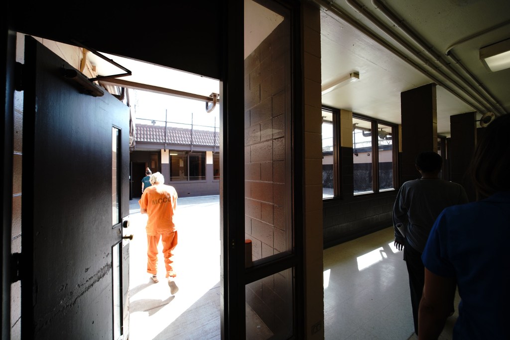 An inmate walks to another module at Oahu Community Correctional Center Jail during OCCC tour. 2019