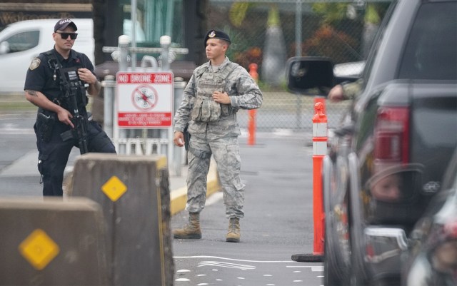 Pearl Harbor Nimitz Gate security officer and military police stand at the gate after shooting.