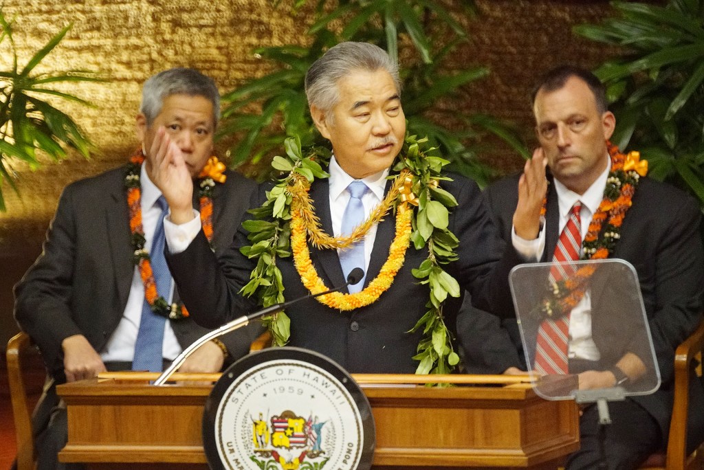 Governor David Ige State of the State address 2020 in the House chambers, Governor gestures for those responsible in getting focused on 2020 legislature to rise to be recognized.