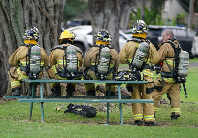HPD police shooting HFD wait for the all clear as structure fire burns.