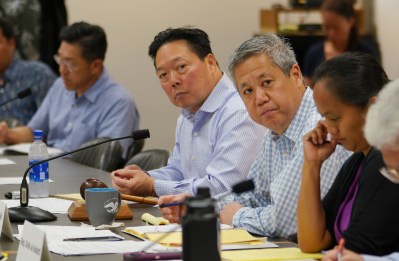 Chair of the Coronavirus Committee Speaker Scott Saiki and left, CEO Bank of Hawaii Peter Ho during committee hearing at the Capitol.