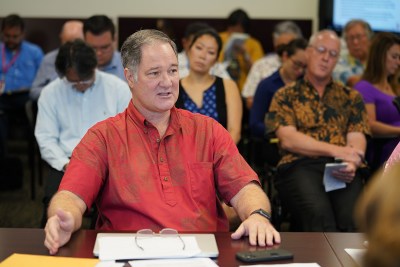 Council on Revenues Member Carl Bonham asks State Economist Eugene Tian about his presentation.