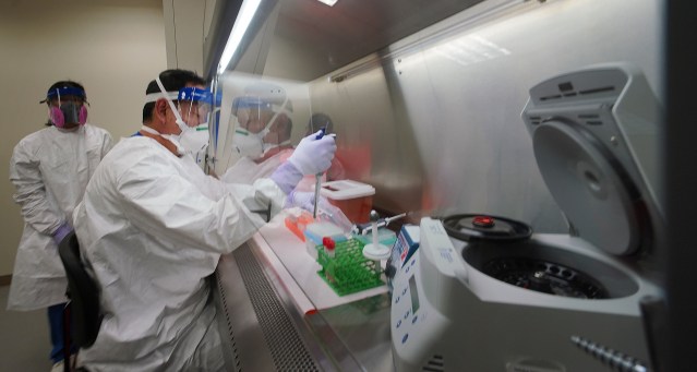State Microbiologist Mark Nagata gives a demonstration of extracting Nucleic acid at the Department of Health, Public Health and Environmental Laboratories located at Waimano Home Road.