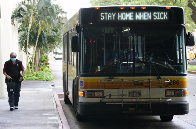 TheBus at Ala Moana Center. Sign reads, ‘Stay home when sick’ due to Coronavirus concerns. March 2020.