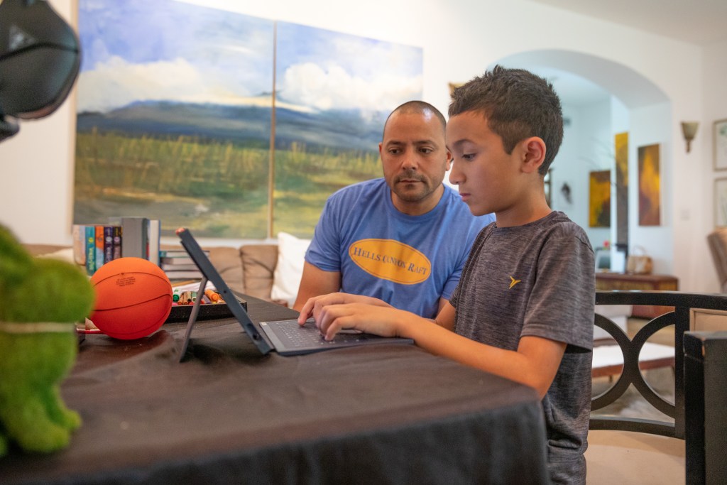 Brendan Punu, 5th grader at Punahou School, remote learning with his family in Makawao, Maui during the 2020 COVID-19 pandemic. Father Brand Punu