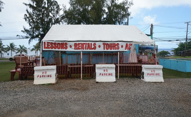 Empty tent and parking lot at a lot with lunchwagons catering to visitors during COVID-19 Coronavirus pandemic. Small business owners wondering when visitors will start arriving again. April 28, 2020.