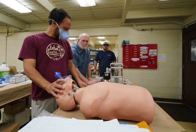 Left to Right, Olin Lagon, Blair Stutz and right, Mark Stutz with a ventilator at Bear Machinery in Kaneohe. Coronavirus COVID19 v2