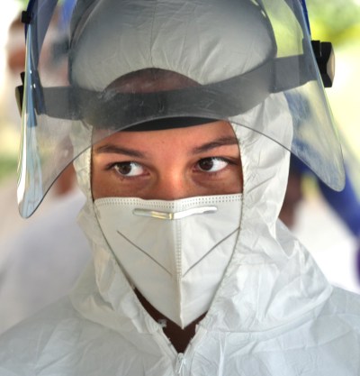 Kaela Akina-Madnussen of Aiea, from the Premier Medical Group Hawaii's COVID Command Mobile Unit, takes a break during the free drive through testing event in Wahiwa,HI on Wednesday, April 22, 2020. (Ronen Zilberman photo Civil Beat)