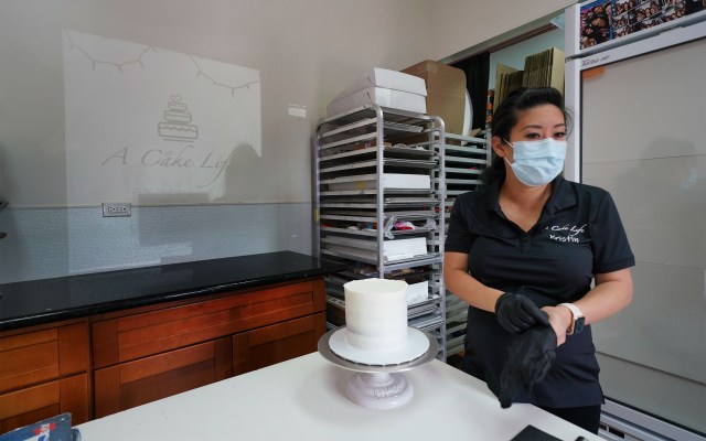 Kristin Kato preps a cake at her shop called A Cake Life located in the Moiliili area. Most wedding now during the pandemic have been smaller gatherings.
