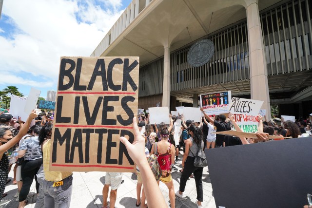 Black Lives Matter marchers arrive at the Capitol after marching from Ala Moana Beach Park.