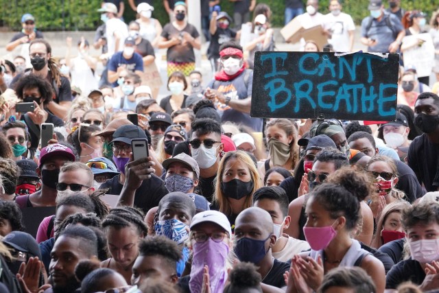 Black Lives Matter marchers arrive at the Capitol Rotunda with a sign that reads, ‘I Can’t Breathe’.