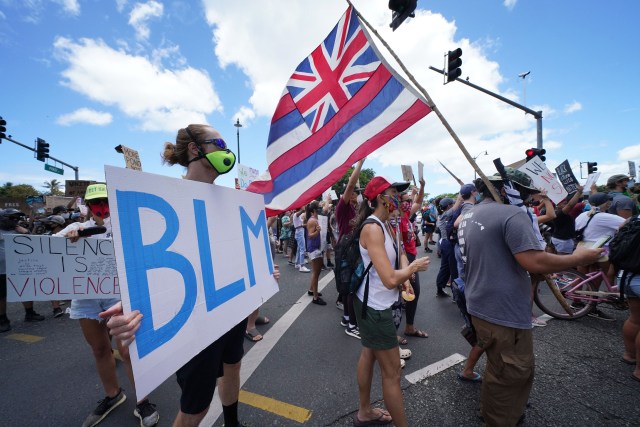Black Lives Matter marchers leave Ala Moana Beach Park on their way to Ala Moana Beach Park.