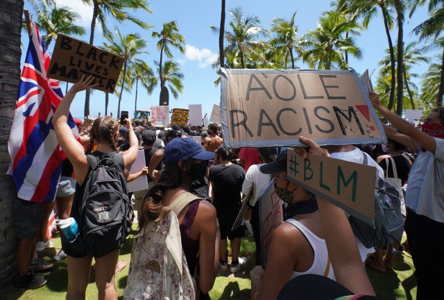 Black Lives matter Peaceful Protest supporters arrive at the Duke Kahanamoku Statue after marching from Ala Moana Beach Park.