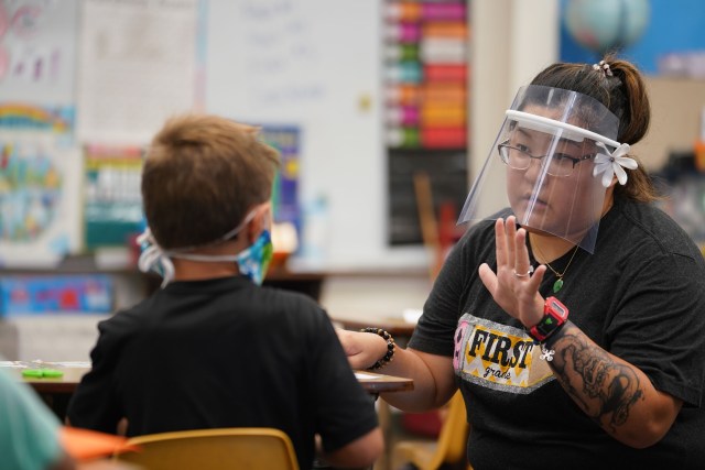 Kaneohe Elementary School summer school teacher Jolyn Yoneshige works on lesson with protective face shield on during COVID-19 pandemic. June 12, 2020