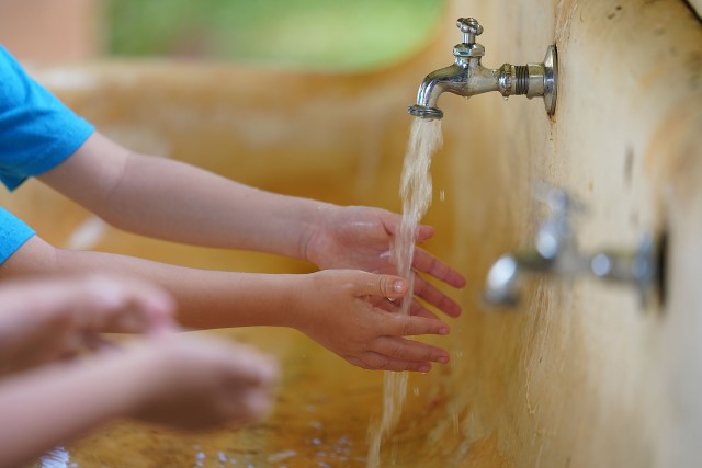 Kaneohe Elementary School summer school students wash their hands before school starts during COVID-19 pandemic. June 12, 2020