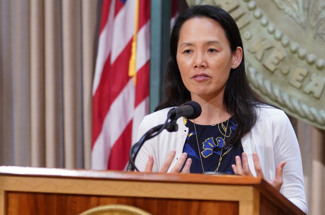 Department of Health Edpidemiologist Sarah Park gestures during press conference on spike of 41 positive cases of COVID-19.