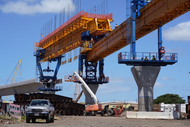 HART rail guideway columns leaving Airport industrial area as construction moves towards MIddle Street and town. July, 10, 2020