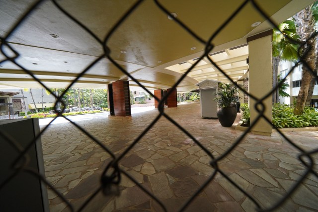 Sheraton Waikiki with view thru chainlink fence at the lobby area during COVID-19 pandemic. July 23, 2020