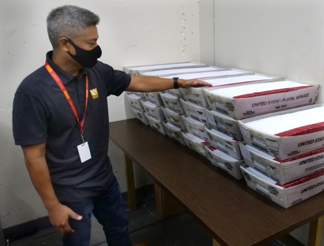 Honolulu City & County Elections Administrator, Rex Quidilla, points to ballots that arrived from the post office to the city elections office to be verified on Friday August 7, 2020. Quidilla said “the (ballot) turnout record is being broken as we speak." (Ronen Zilberman photo Civil Beat)