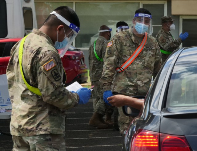 National Guardsmen registers a resident who showed up for COVID-19 testing at the Leeward Community College in Pearl City, Wednesday, August 26, 2020. (Ronen Zilberman photo Civil Beat)