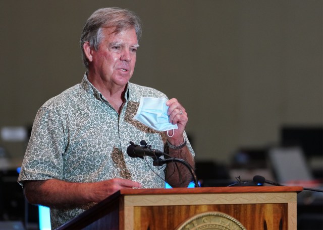 Department of Health Director Dr. Bruce Anderson holds mask and emphasizing the use of mask and being vigilant during contact tracing press conference held at the Hawaii Convention Center. August 19, 2020
