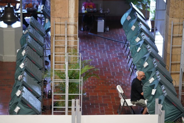 Honolulu Hale Voter Service Center as a voter casts his ballot electronically. August 6, 2020