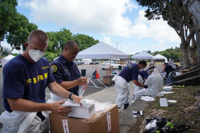 Kaneohe District Park COVID19 surge testing with HFD Fire Department firefighters assisting with unused test kits. August 26, 2020