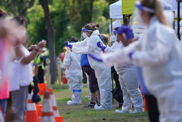 Medical personnel assist patients with self swab COVID-19 testing at Kapioani Park near the Bandstand. August 31, 2020