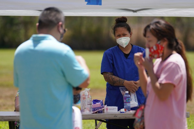 Medical personnel assist with self swabbing during surge COVID-19 testing held at Kalihi Valley District Park. September 4, 2020