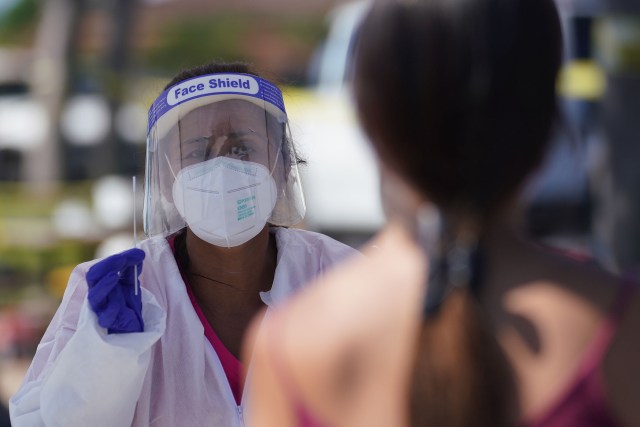 Medical personnel assist with self swab COVID-19 surge testing held at Waikele Shopping Center. September 11, 2020
