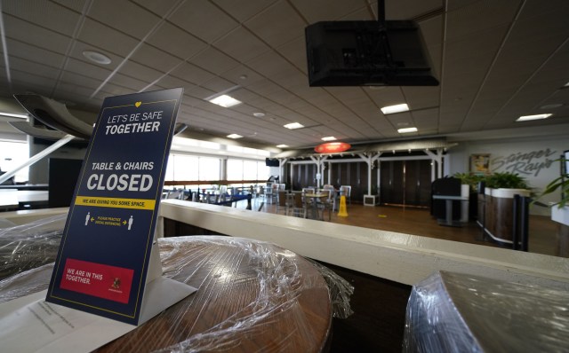 Daniel K. Inouye International Airport interland terminal restaurant sign outlining the tables and chairs are closed during COVID-19 pandemic. September 23, 2020
