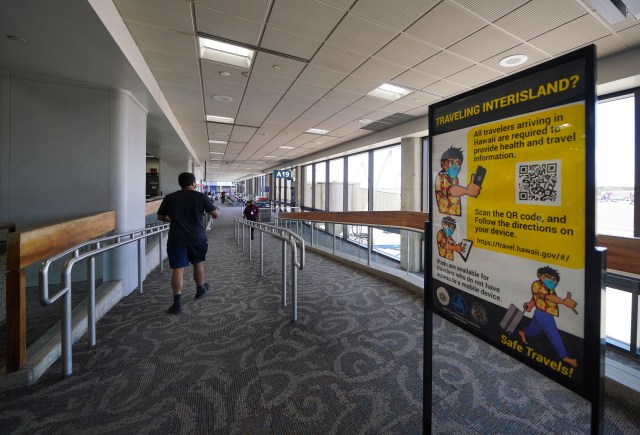 Sign outlining the need to check into the website ‘travel.Hawaii.gov’ at the Daniel K. Inouye International Airport, interisland terminal. Once travel arrangements are logged into the site, a QR code is issued and needed when arriving into the different airports during COVID-19 pandemic. September 23, 2020