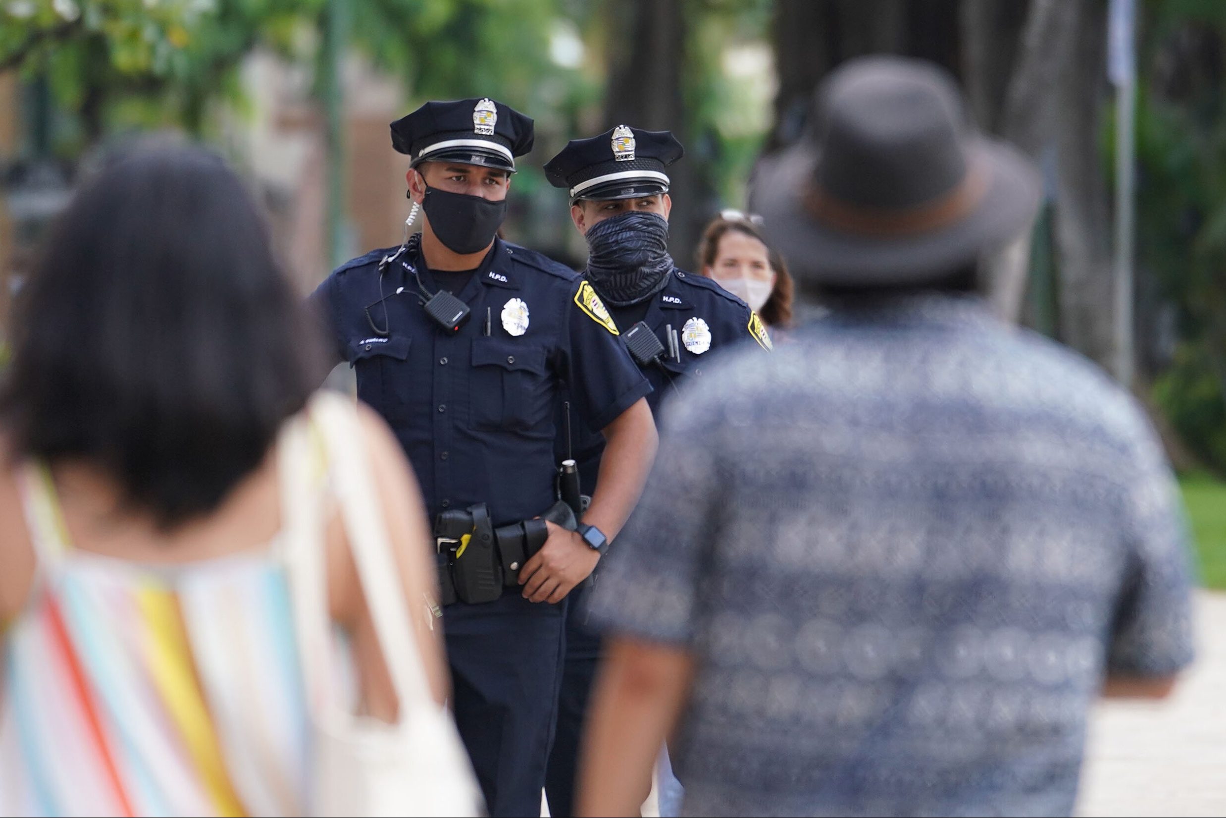 HPD Honolulu Police officers patrol along Kalakaua Avenue during COVID-19 pandemic. October 28, 2020