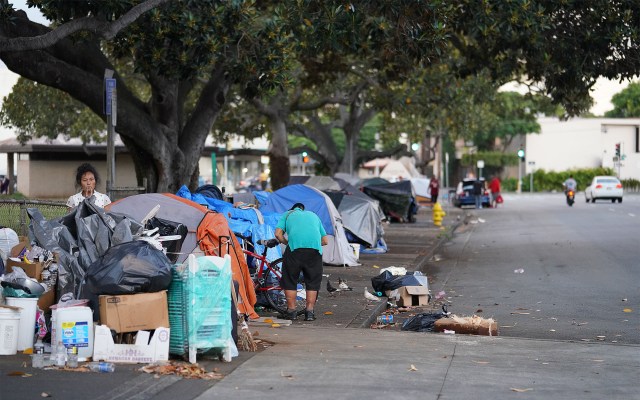 A row of tents along Moliili Neighborhood Park along South Beretania Street during COVID-19 pandemic. October 19, 2020