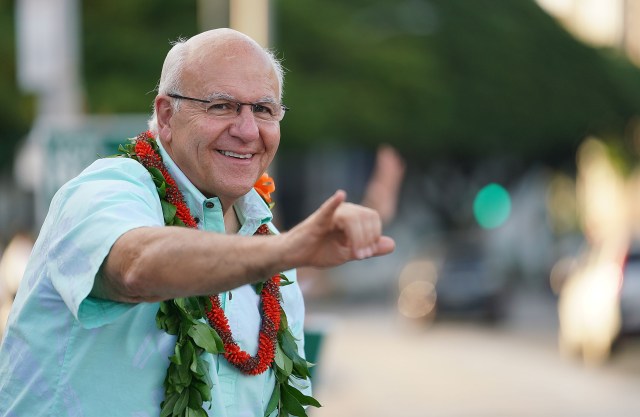 Honolulu mayoral candidate Rick Blangiardi flashes the shaka to oncoming motorists along Beretania Street fronting the Capitol. October 13, 2020