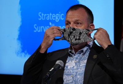 Lt Governor Josh Green gestures with his mask during press conference held at the Hawaii Convention Center on requiring arriving passengers to have a COVID-19 test before arriving to Hawaii. October 1, 2020