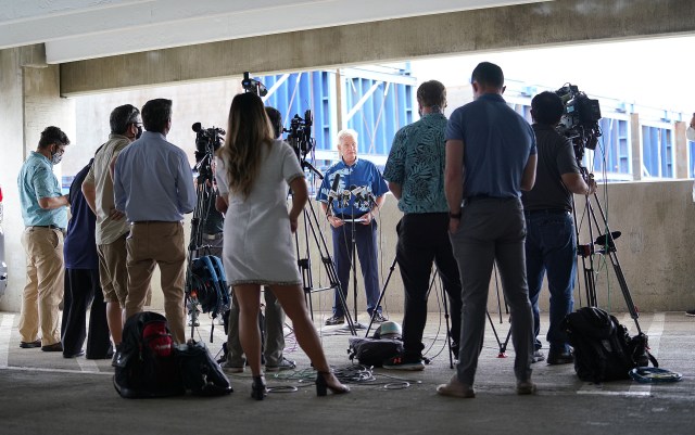 Media crowded together during Mayor Kirk Caldwell’s ‘conceptual rail plan’ press conference held at the Daniel K. Inouye International Airport parking garage.